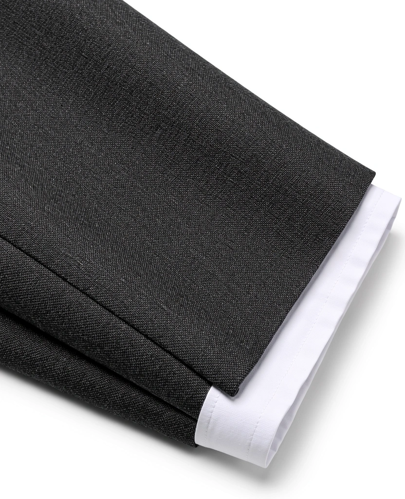 Detail of a tailored suit and clean shirt cuff